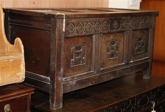 An 18th century carved oak panelled coffer W.126cm